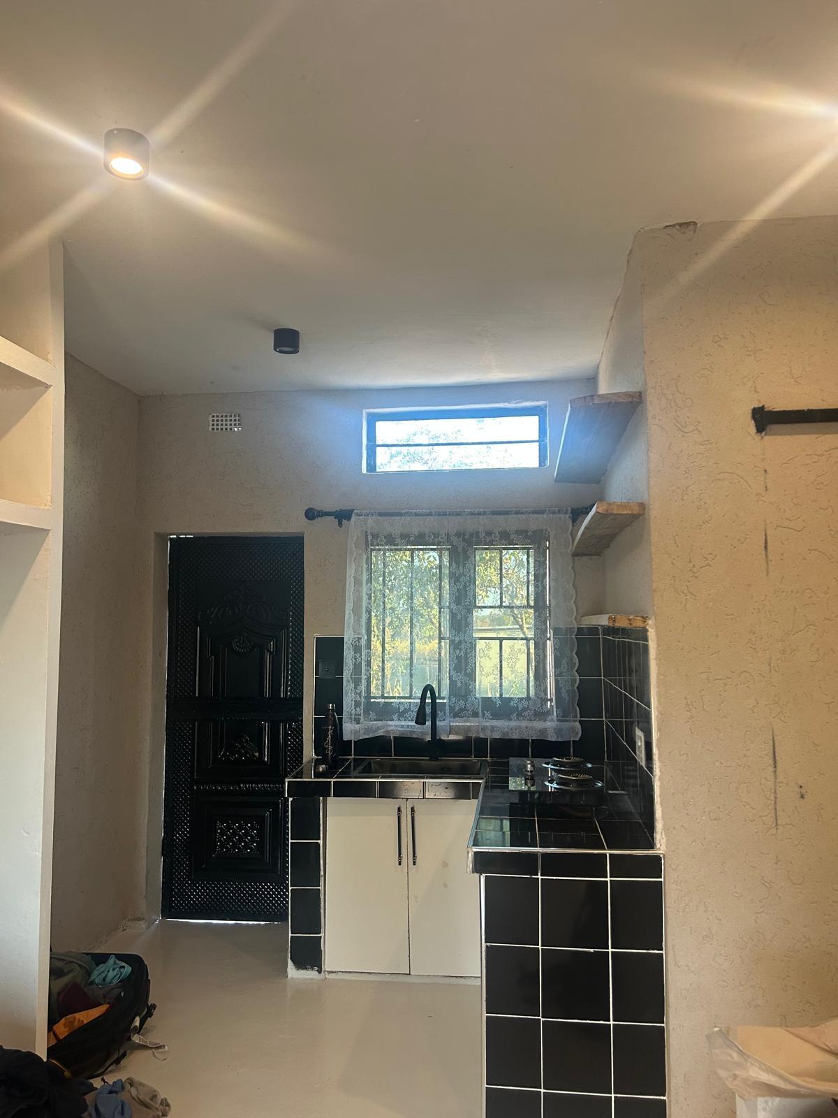 Private black-and-white self-catering kitchen